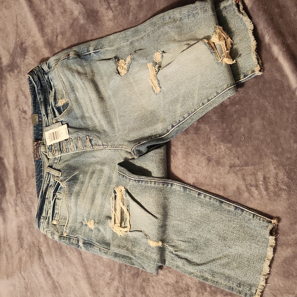 Button fly distressed jeans